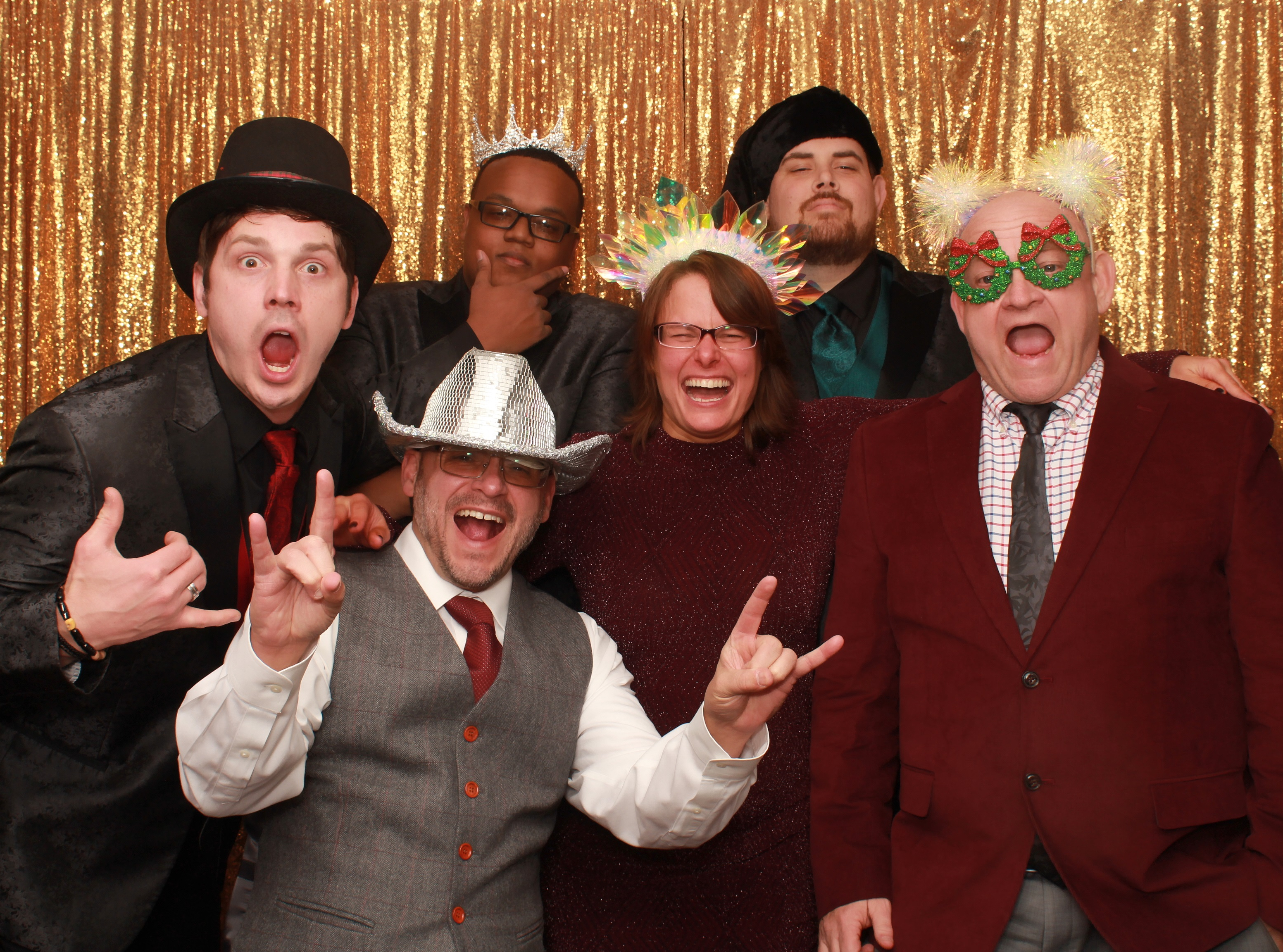 Employees posting for a photo in a photo booth